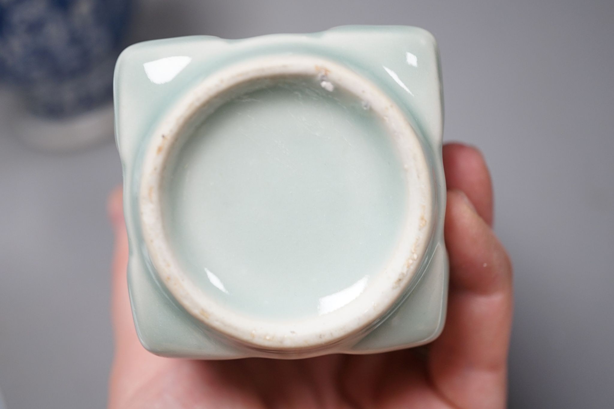 A Chinese blue and white ovoid vase, 20cm a similar dish and plates and celadon glazed vase